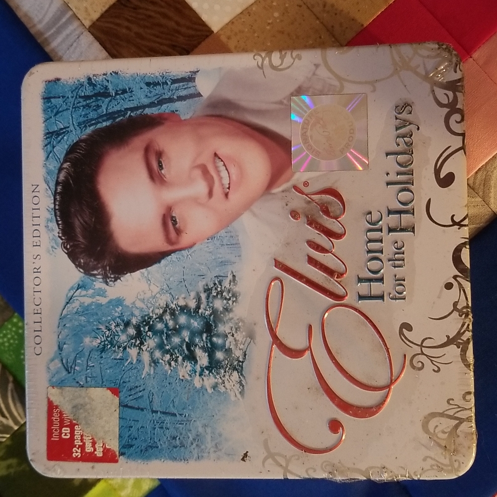 CD. 32 page booklet. Guitar candle and candle holder. 5 Elvis postcards.